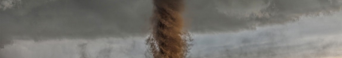 Jaw-dropping, rare anti-cyclonic tornado tracks in open farm land narrowly missing a home near Simla, Colorado.